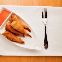 Shrimp Rolls (4) · Fried crispy, served with Curry Curry sweet chili sauce.