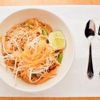 Pad Thai  · Skinny rice noodles pan fried with egg, bean sprouts, and green onions, garnished with groun...