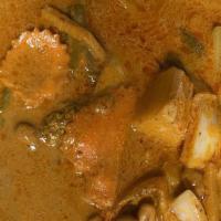 Massaman Curry · Contain Nut. With coconut milk, sliced potatoes, carrots and cashew nuts.