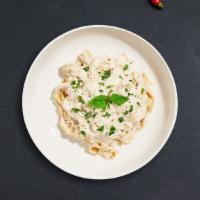 All About Cluckin' Alfredo Pasta · Grilled chicken breast tossed with fettuccine pasta and parmesan cream sauce. Served with ga...