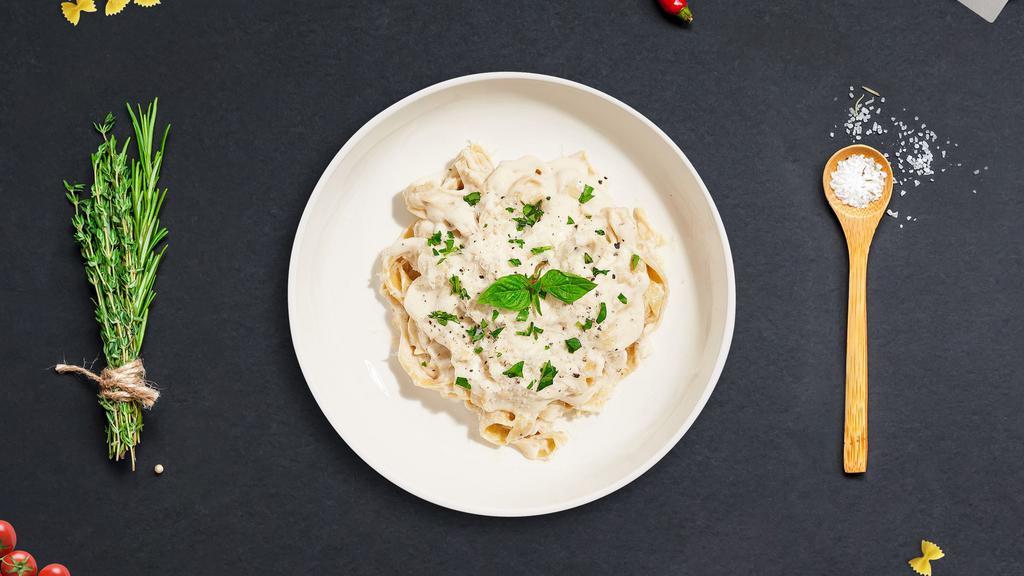 All About Cluckin' Alfredo Pasta · Grilled chicken breast tossed with fettuccine pasta and parmesan cream sauce. Served with garlic bread and your choice of soup or salad.