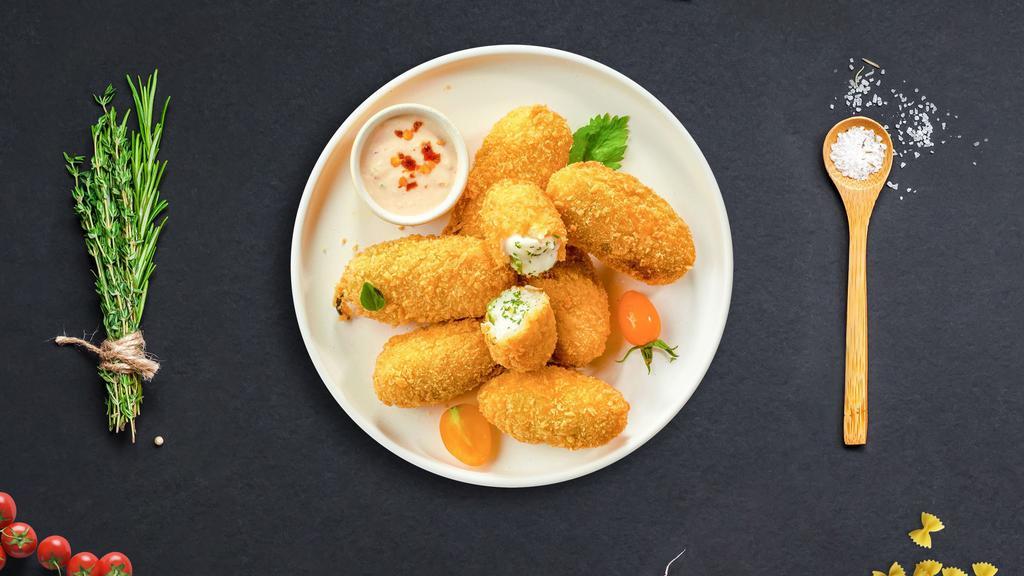 Popping Peno · (Vegetarian) Fresh jalapenos coated in cream cheese and fried until golden brown.