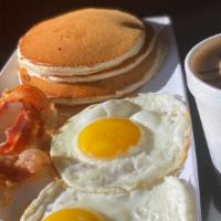 American Breakfast · 3 Fluffy Pancakes, Two Eggs, 2 Bacon Strips/