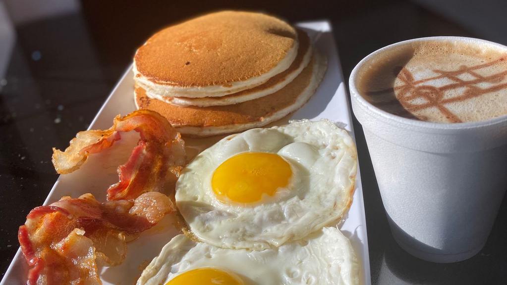American Breakfast · 3 Fluffy Pancakes, Two Eggs, 2 Bacon Strips/