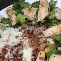 Grilled Chicken Caesar Salad · Grilled Chicken, Lettuce, Croutons, Bacon and parmesan cheese with Caesar Dressing onside.