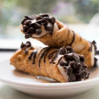 Chocolate Chip Cannolis (3) · Delicate, fried pastry tubes, filled with sweet ricotta and chocolate chips. Dusted with pow...