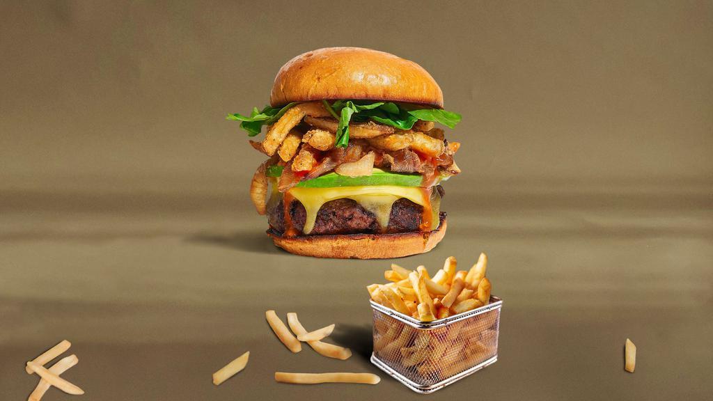 The Face Of French Fries Burger · American beef patty topped with fries, avocado, caramelized onions, ketchup, lettuce, tomato, onion, and pickles. Served on a brioche bun.