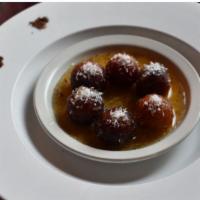 Gulab Jamun · Deep-fried milk balls in sweet syrup.