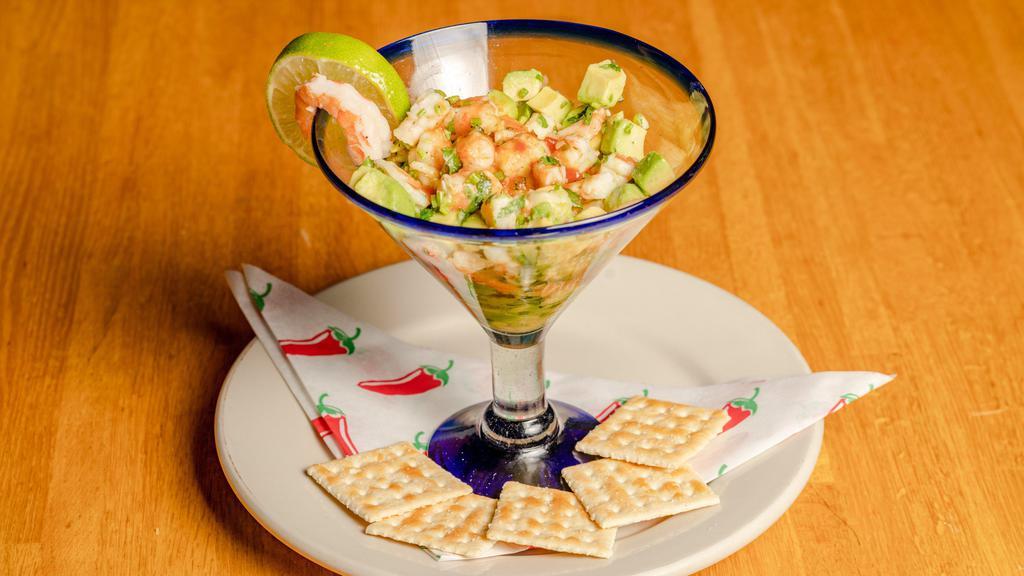 Avocado Shrimp Ceviche · Shrimp marinated in lime, spices, and cilantro with avocado cubes and light Mexican cocktail sauce.