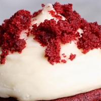 Famous Red Velvet Cupcake · Our famous red velvet cupcake topped with cream cheese frosting and a garnish of cake crumbl...