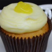 Lemon Drop Cupcake · Lemon filled vanilla cake, topped with lemon buttercream and a dollop of lemon garnish!.