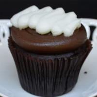 Chocolate Cream Cupcake · Chocolate cake filled with our signature buttercream, topped with fudge icing and a drizzle ...