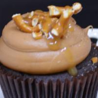 Caramel Crunch Cupcake · Chocolate cupcake topped with our signature caramel buttercream and garnished with pretzels,...