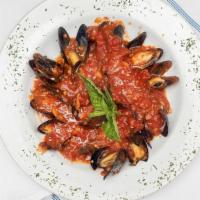 Mussels Marinara · Prince Edward Island mussels sautéed in extra virgin olive oil and garlic topped with marina...