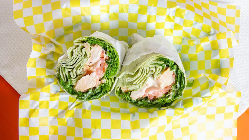 Chicken Caesar Wrap · Grilled chicken, romaine lettuce, tomatoes and shaved Parmesan cheese with cream Caesar dressing. Served on your choice of tortilla.