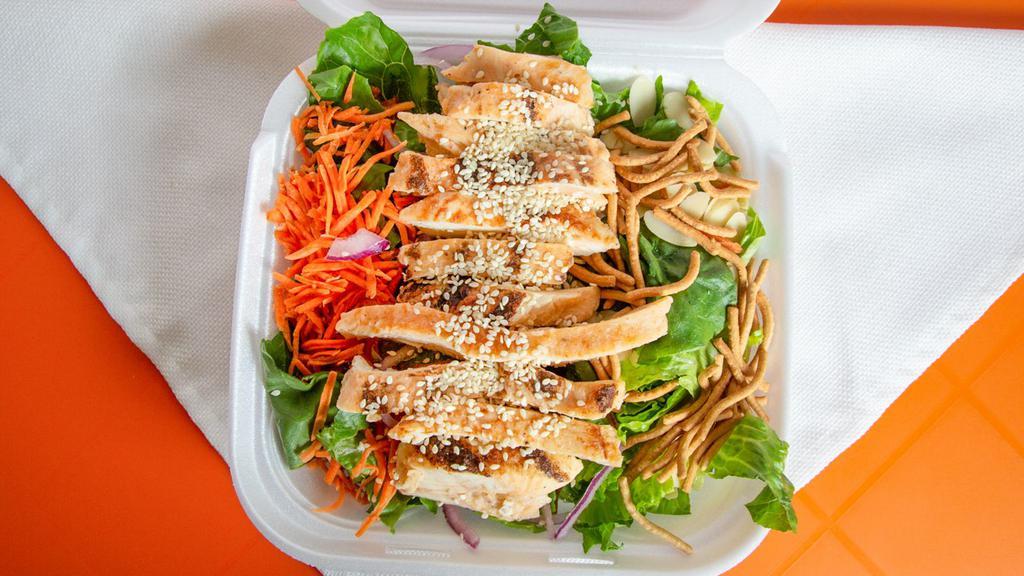 Asian Oriental Salad · Grilled chicken, romaine lettuce, almonds, oriental noodles, Mandarin, oranges, snap peas, carrots, red onions, pineapples, and sesame ginger dressing.