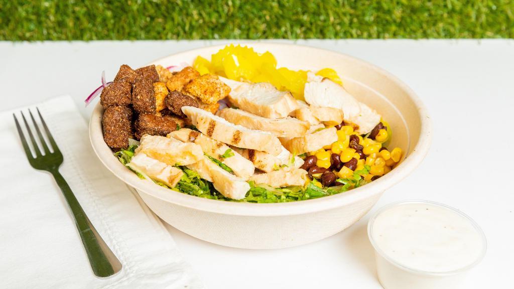 Jamaica Jerk Salad · Grilled chicken topped with jerk sauce, red onions, banana peppers, black beans, and sweet corns. Served on romaine lettuce and croutons.