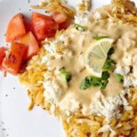 Crab Hash · Lump Crab and tomatoes served over cheesy hash browns topped with our Cajun cream sauce.