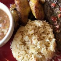 Churrasco Steak · 8 oz. of grilled steak to perfection served with moro rice, fried plantains, fresh salad, an...
