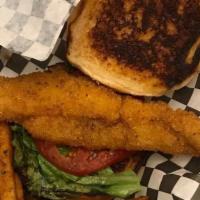 Whiting Fish Sandwich · Served with fries and hush puppies.