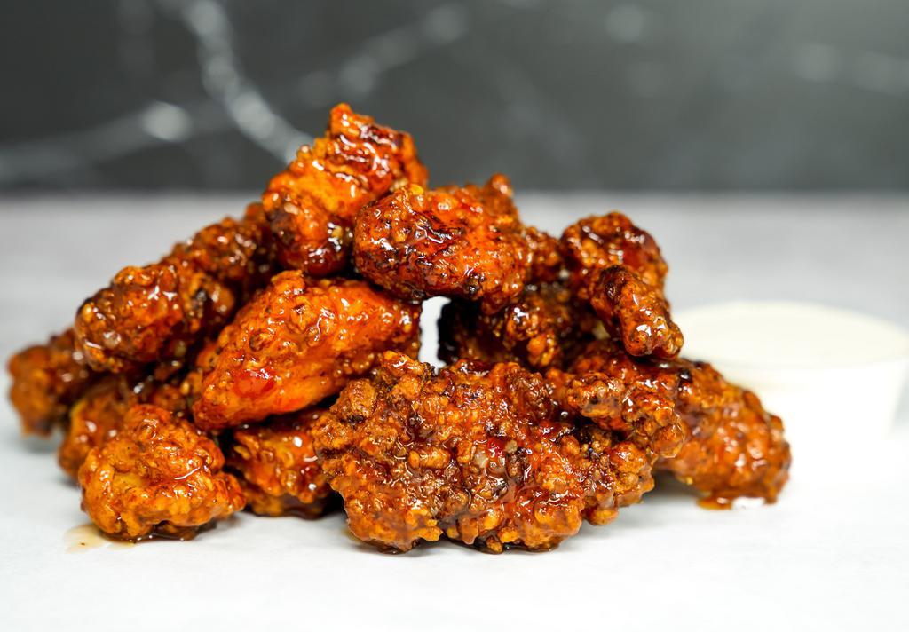 Crispy Boneless Wings · Crispy boneless chicken wings tossed in 1 wing flavor and served with fresh carrot & celery sticks and homemade buttermilk ranch or blue cheese dressing