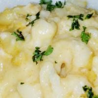 Baked Macaroni & Cheese · Four cheese baked macaroni and cheese