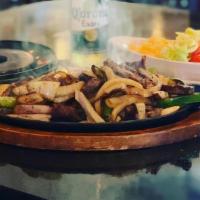 Chicken Fajitas · Chicken Grilled With Onions And Green Peppers. Served With Cheddar Cheese, Diced Tomatoes, S...