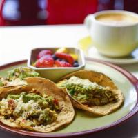 Breakfast Tacos · Three corn tortillas with Mexican cheese, beans, tomatoes, onions, bell pepper, scrambled eg...