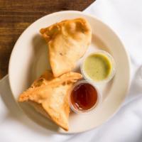 Vegetable Samosa (2 Pieces) · Traditional triangular puffed pastry filled with potatoes, peas, carrots, and mild spices an...