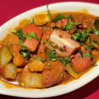 Chicken Curry With Boneless White Meat · Chicken prepared with ground spices and herbs.