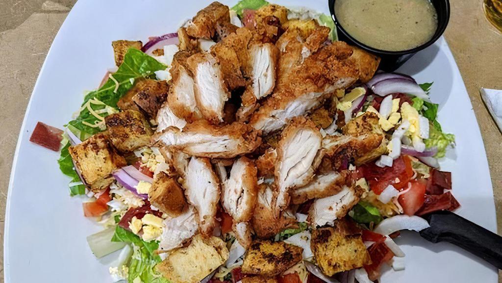 Crispy Chicken Salad 3Po · Romaine lettuce topped with crispy chicken, tomatoes, bacon, cheddar cheese, red onions, egg, & croutons.