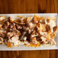 Triple Cheese Chicken Nachos · Perfect for Cheese Lovers! Crispy fried chicken chunks covered in cheese dip and topped with...