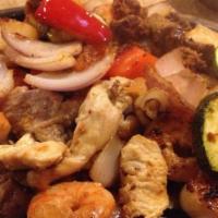 Special Fajitas · A combination of chorizo, steak, chicken, pork carnitas, and shrimp, cooked with sautéed veg...