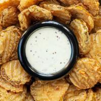 Salt And Pepper Fried Pickles · Crisp dill pickle chips are hand battered and fried to golden brown perfection, sprinkled wi...