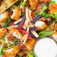 Prairie Chicken Salad · The best of the Southwest comes to you on a bed of crisp salad greens topped with cheddar ja...