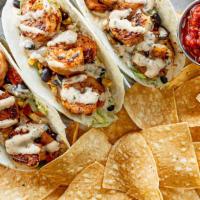 Grilled Shrimp Tacos · Perfectly seasoned and portioned, our tender grilled shrimp is topped with black bean & corn...