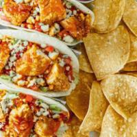 Buffalo Chicken Tacos · Your choice of grilled or fried chicken topped with lettuce, tomato, blue cheese crumbles an...