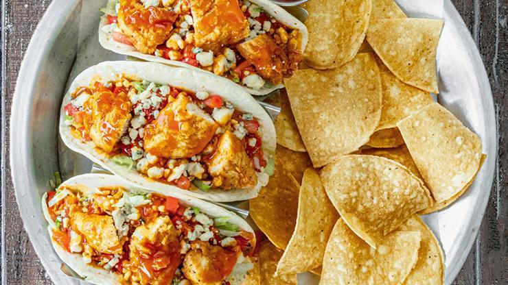 Buffalo Chicken Tacos · Your choice of grilled or fried chicken topped with lettuce, tomato, blue cheese crumbles and drizzled with medium buffalo sauce.