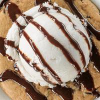 Buffalo Chip · A warm chocolate chip cookie topped with a scoop of vanilla ice cream and drizzled with choc...