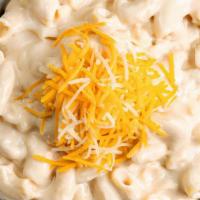 Macaroni & Cheese · Creamy macaroni & cheese topped with shredded cheddar jack cheese