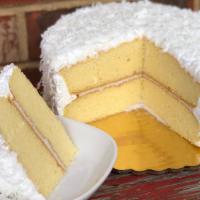 Coconut Cake · Moist Yellow Layer Cake filled with Coconut Cream, covered in Divinity Icing and Shredded Fl...