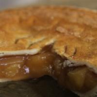 Apple Pie · Scratch cooked apple cinnamon filling in hand rolled pie crust.  8 inch diameter, serves 6 m...