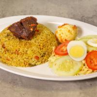 Fried Rice · Curried rice mixed with vegetables, with fried plantain on the side.