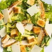 Side Caesar · Shaved Parmesan cheese, homemade croutons, mixed greens, and Caesar dressing.