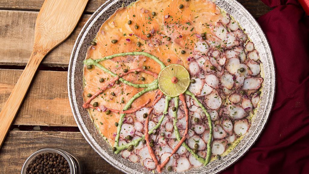 Mixed Carpaccio · Signature sauce, red onions, capers, black pepper, olive oil, lemon, and parsley.