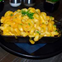 Truffle Mac-N-Cheese · Guest's Favorites. Cavatappi Pasta, Panko Parmesan Crust, Sharp Cheddar, and American Cream ...