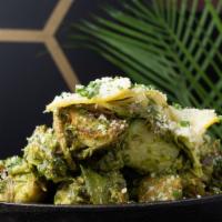 Crispy Brussels · Arugula Pesto, Parmesan, and Lemon Confit.