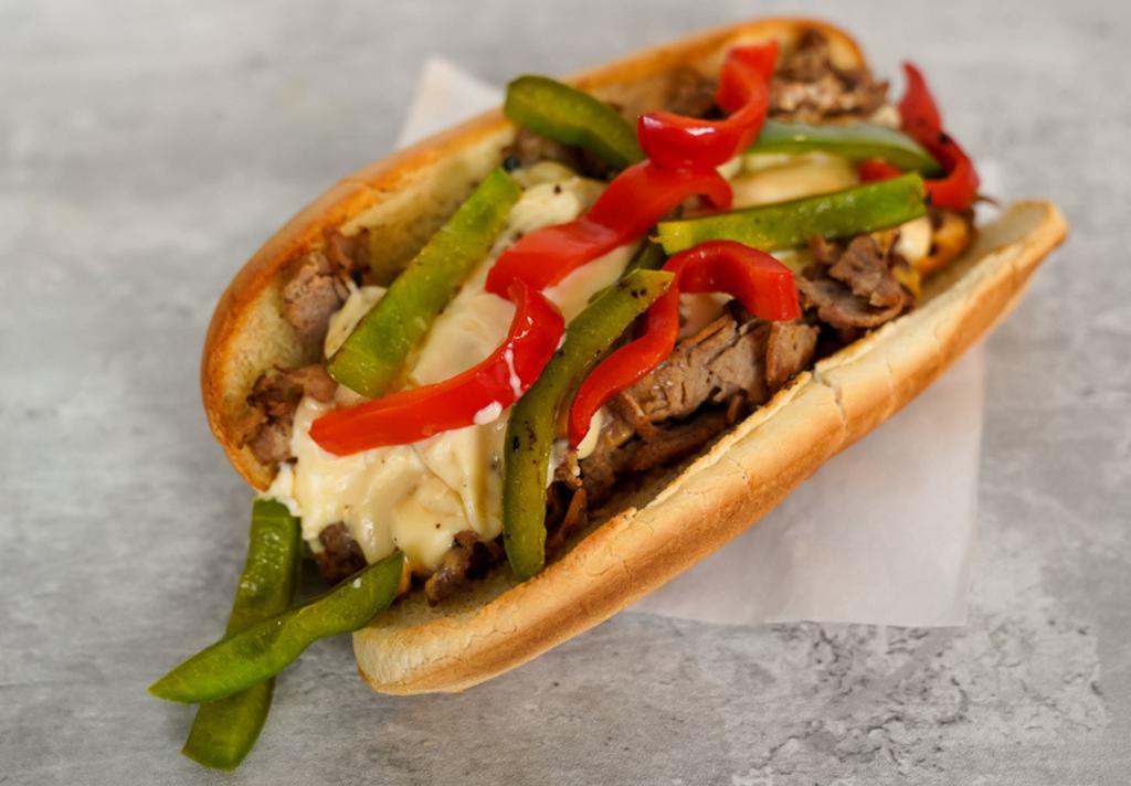 Grilled Pepper Cheesesteak · 8” Philly cheesesteak loaded with grilled steak, melted cheese, and grilled bell peppers on a toasted hoagie roll