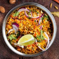 Shrimp Biryani Treasury · Aromatic basmati rice with tender shrimp cooked with nuts, herbs, and spices.