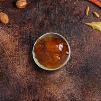 Mango Chutney · Fresh sliced mangoes in sweet sauce and spices.